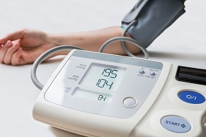 Image of woman having blood pressure checked