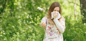 Image of young woman whose allergies are effecting her hearing.